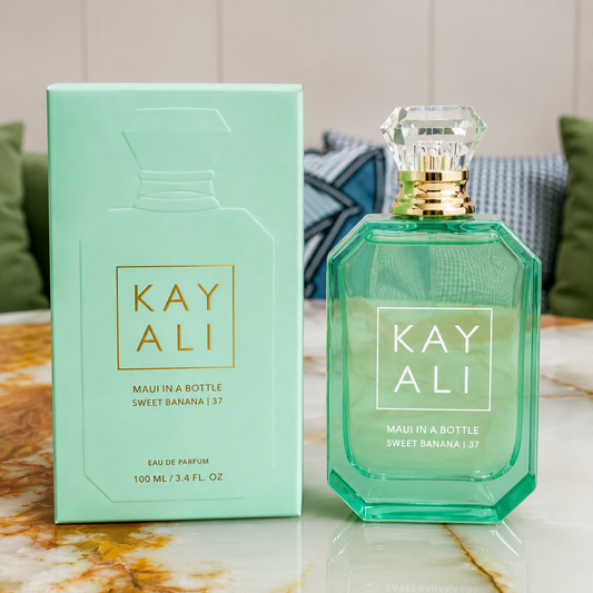 Kay Ali perfume bottle and packaging on a marble surface with a neutral background